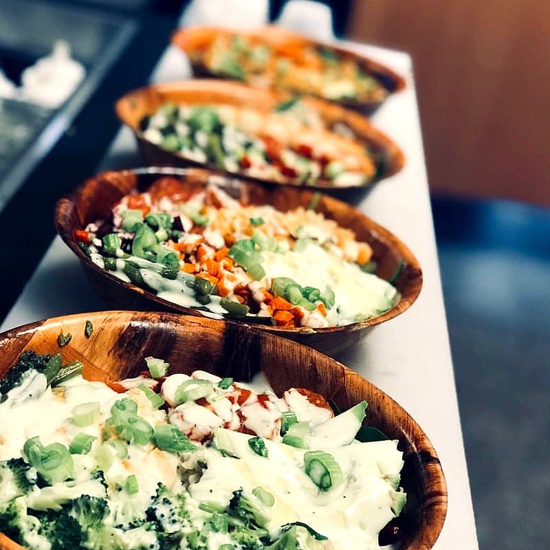 Row of fresh salad bowls