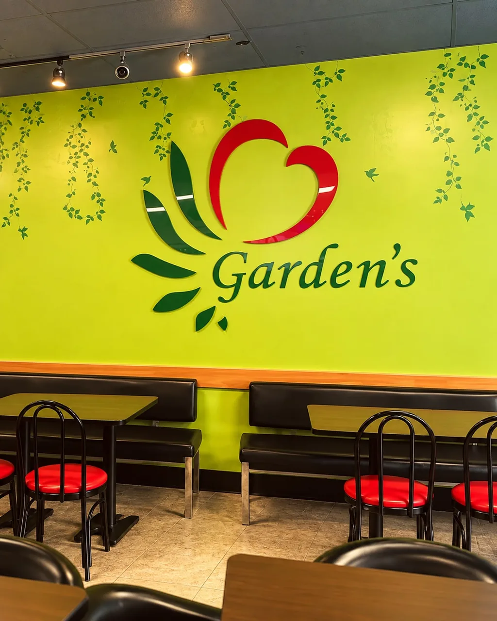 The Garden's heart logo on the green dining room wall